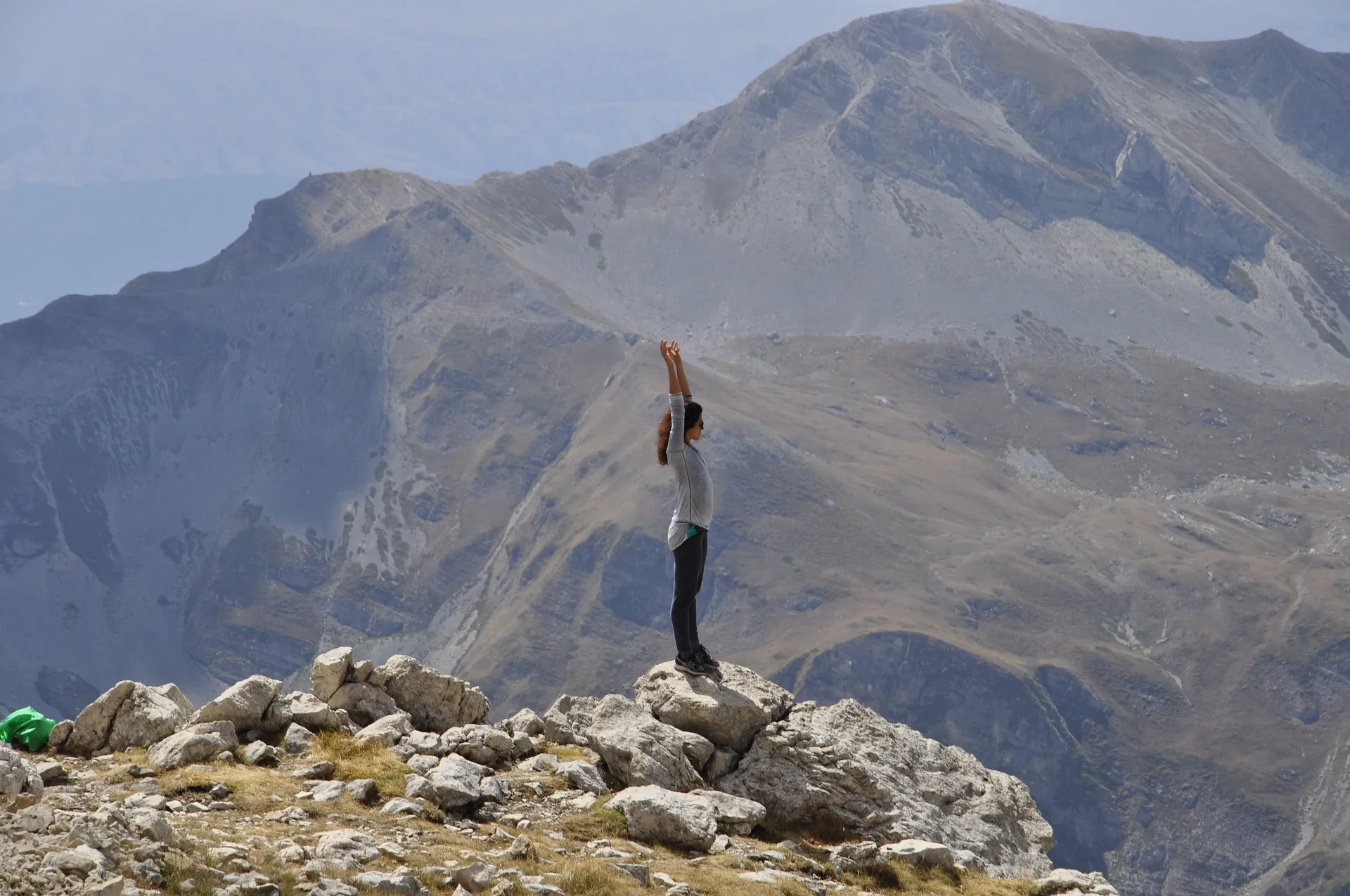 individual standing on a mountain