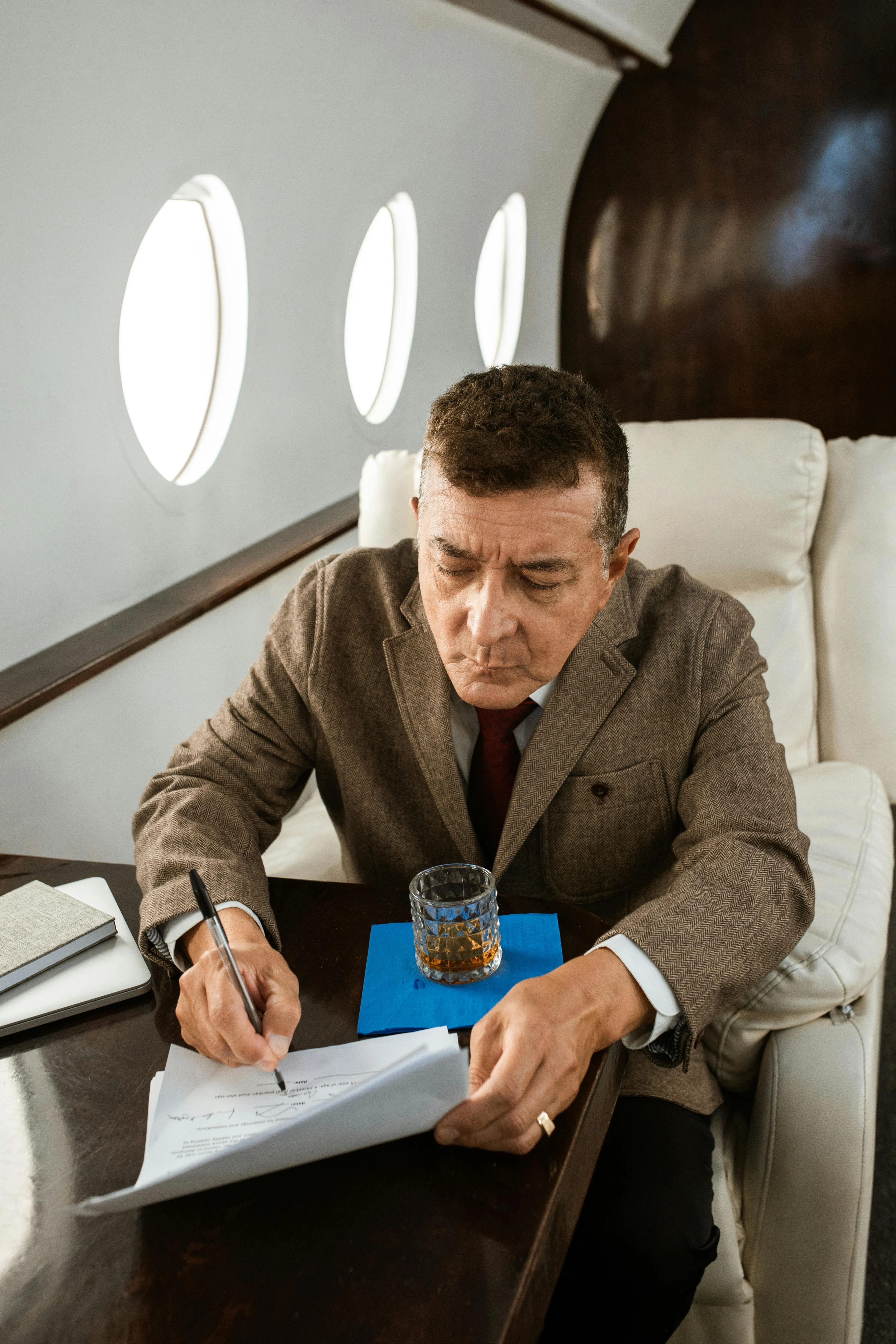 man on jet signing off on will