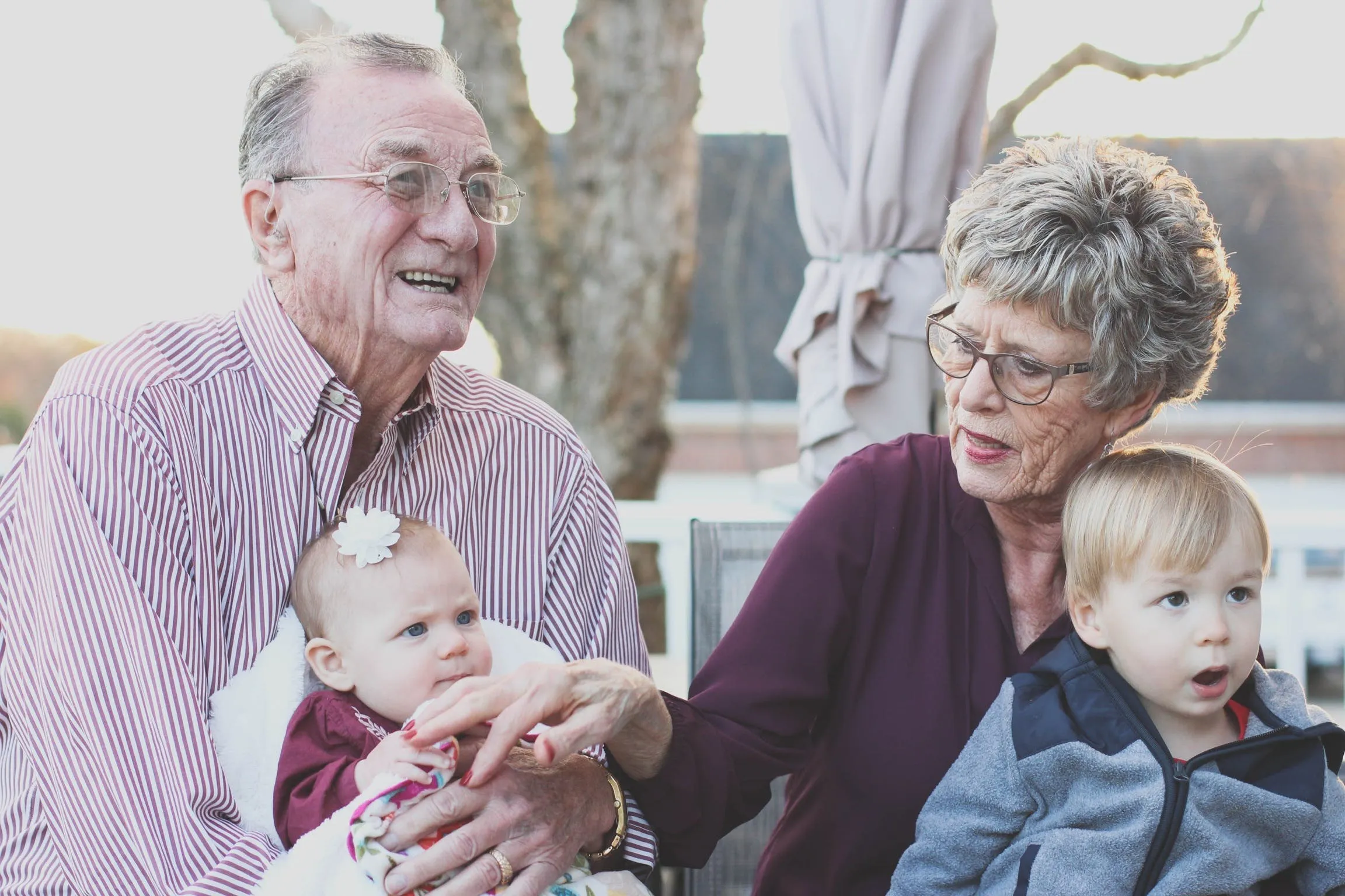happy elderly couple laughing with one and other